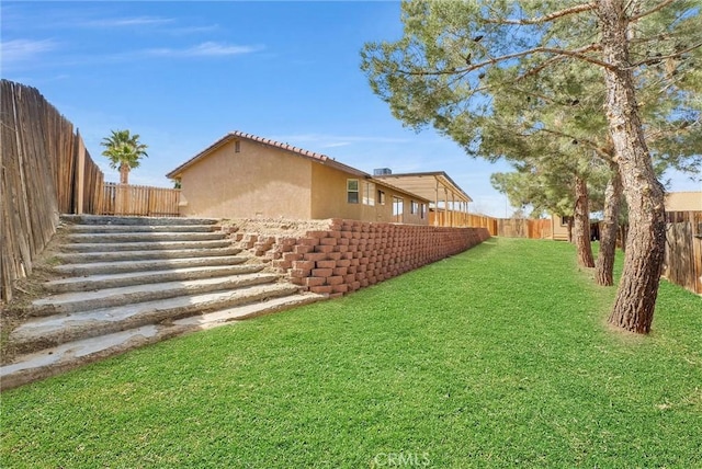 view of yard with a fenced backyard