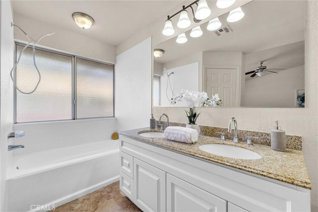 bathroom featuring ceiling fan, double vanity, a sink, and visible vents