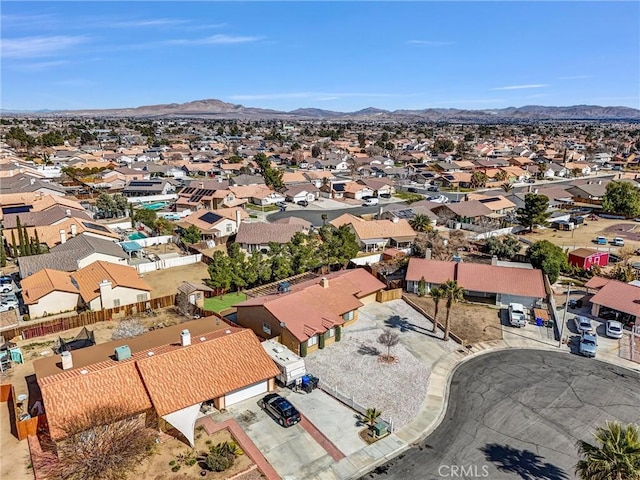 birds eye view of property with a residential view and a mountain view