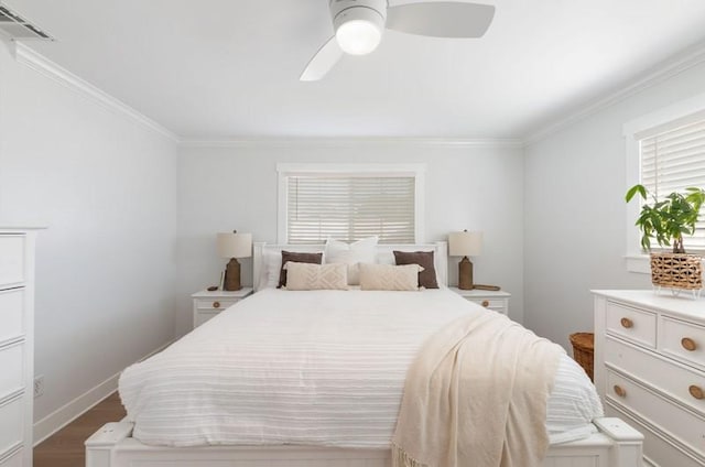 bedroom with baseboards, visible vents, ceiling fan, dark wood-type flooring, and crown molding