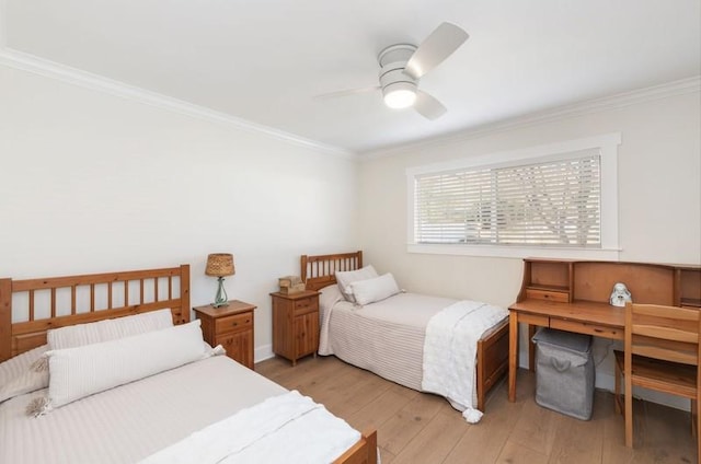 bedroom featuring ceiling fan, ornamental molding, and light wood-style flooring