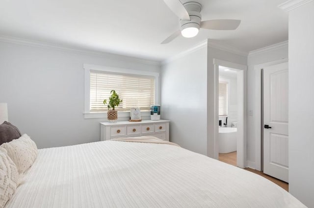 bedroom featuring a ceiling fan, crown molding, and ensuite bathroom