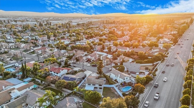 birds eye view of property with a residential view