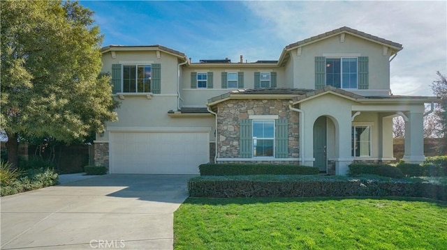 view of front of house with driveway, a garage, stone siding, stucco siding, and a front yard