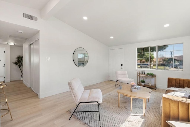 living area with vaulted ceiling with beams, baseboards, light wood-style flooring, and recessed lighting