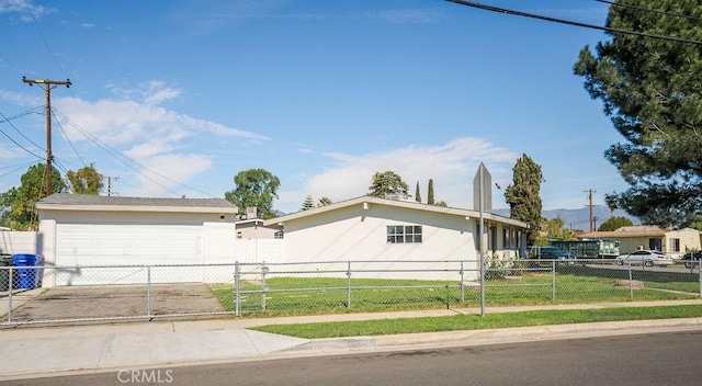 ranch-style house featuring a garage, a front yard, fence, and stucco siding