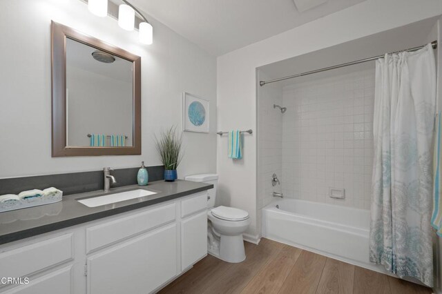 4200 Via Arbolada Unit 207, Los Angeles, CA 90042 - full bath featuring wood finished floors, vanity, and shower / tub combo with curtain