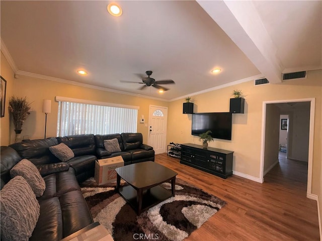 living room with lofted ceiling with beams, wood finished floors, visible vents, and crown molding