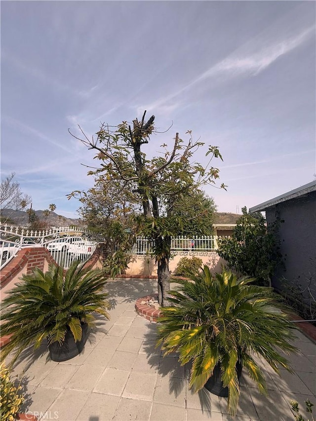 view of patio / terrace featuring fence