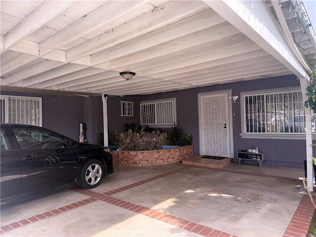 exterior space with a carport