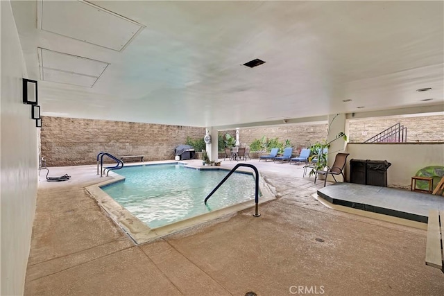 community pool with a patio