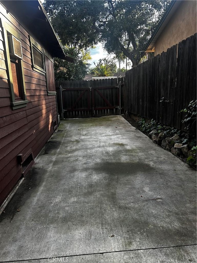 exterior space featuring a gate and fence