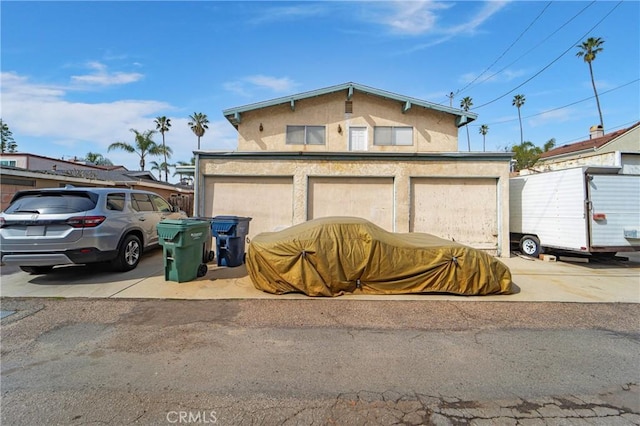 garage featuring driveway