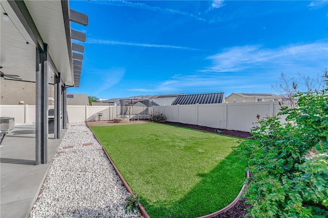 view of yard with a patio and a fenced backyard