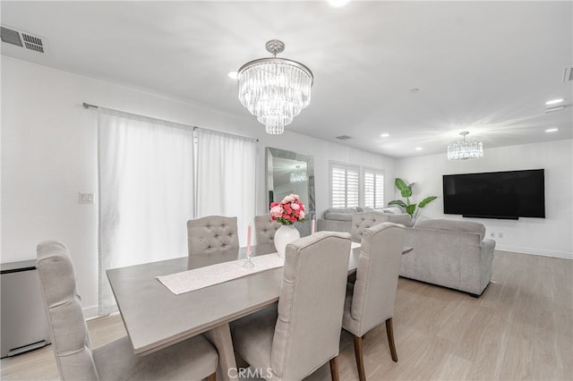 dining space with a notable chandelier, recessed lighting, visible vents, baseboards, and light wood-style floors