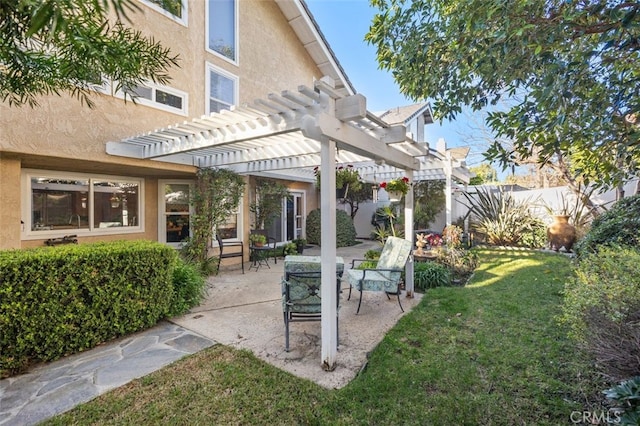 view of yard featuring fence, a pergola, and a patio