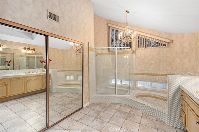 bathroom with visible vents, an inviting chandelier, a shower stall, vanity, and tile patterned floors