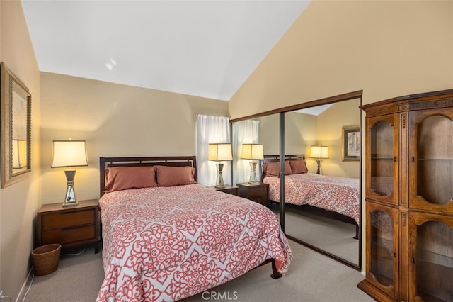 bedroom featuring light carpet and lofted ceiling