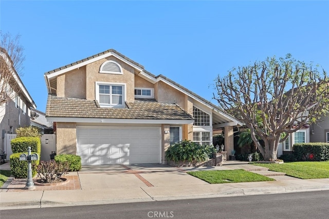 traditional-style house featuring concrete driveway, a tile roof, an attached garage, and stucco siding