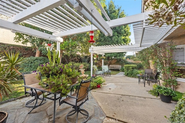 view of patio with outdoor dining area and a pergola