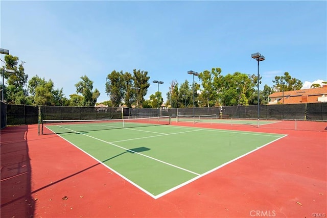 view of sport court featuring community basketball court and fence