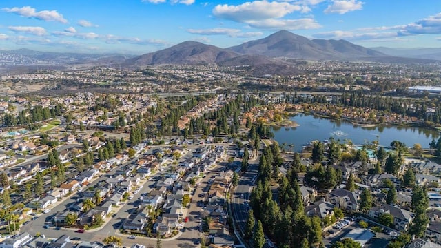 drone / aerial view with a residential view and a water and mountain view