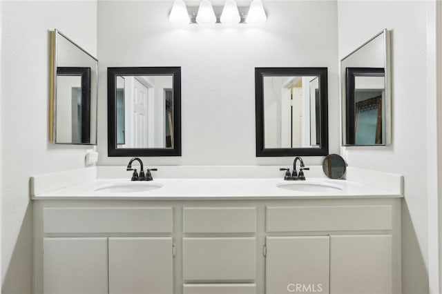 full bath with double vanity and a sink