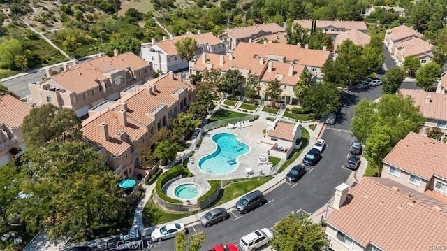 birds eye view of property with a residential view