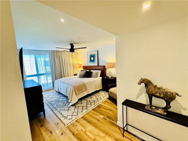 bedroom featuring light wood finished floors, ceiling fan, access to exterior, and recessed lighting