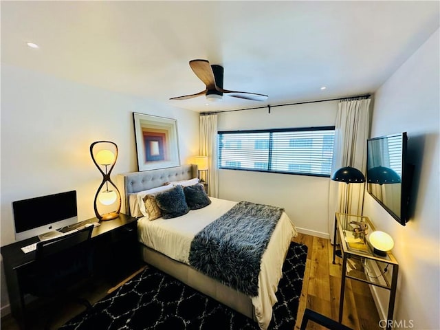 bedroom with recessed lighting, ceiling fan, and wood finished floors