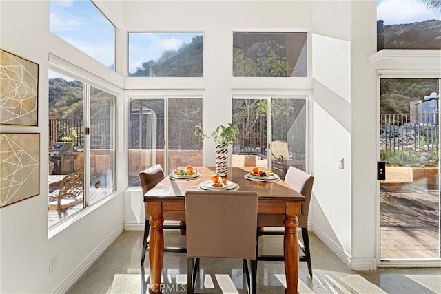 sunroom / solarium featuring a healthy amount of sunlight