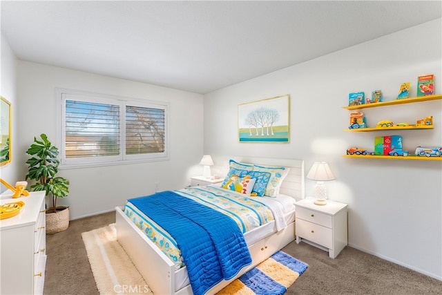 carpeted bedroom with baseboards