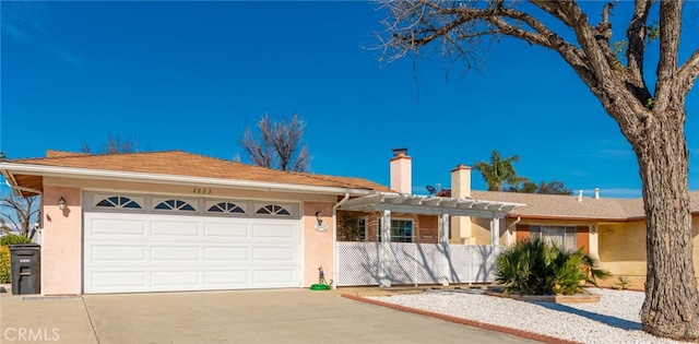 ranch-style house with a chimney, a pergola, an attached garage, and stucco siding