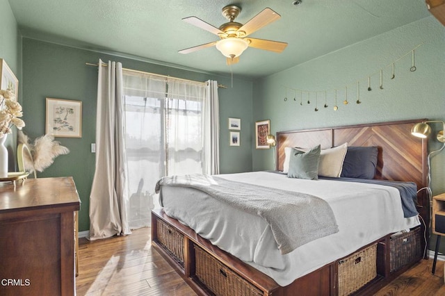 bedroom featuring ceiling fan and wood finished floors