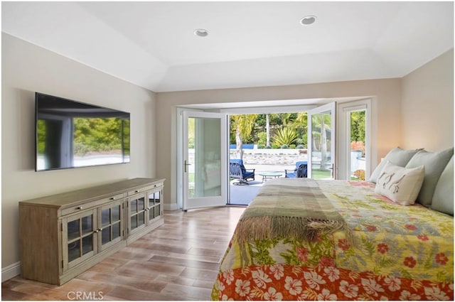 bedroom with light wood-type flooring, access to outside, baseboards, and recessed lighting