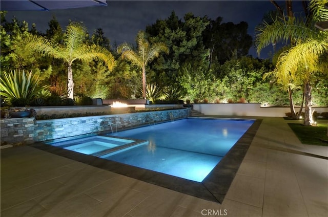 view of pool with an in ground hot tub and a patio