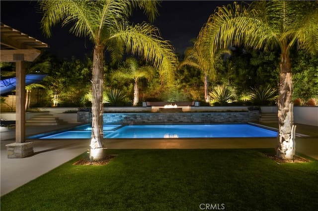 outdoor pool with a yard