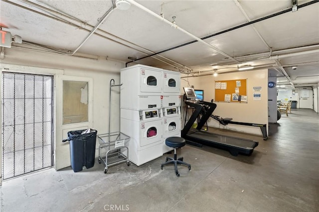 garage with stacked washer / dryer