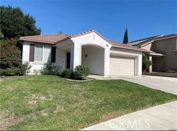 view of front of home featuring an attached garage, a front lawn, concrete driveway, and stucco siding