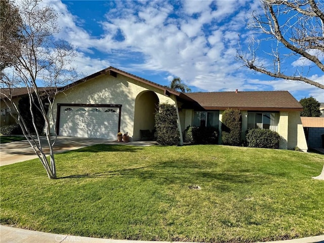 ranch-style house featuring concrete driveway, an attached garage, a front lawn, and stucco siding