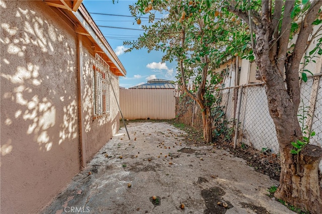 view of yard featuring a patio area and fence