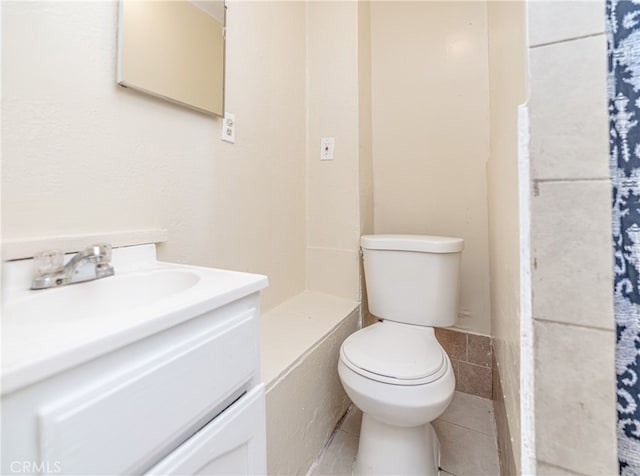 full bath featuring toilet and vanity