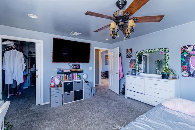 bedroom featuring a closet, visible vents, a ceiling fan, and carpet floors