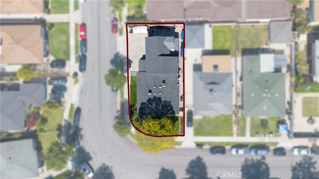 birds eye view of property with a residential view