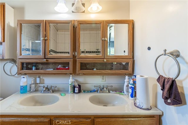 full bath with double vanity and a sink