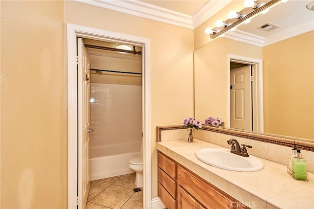 bathroom with visible vents, toilet, ornamental molding, vanity, and tile patterned floors