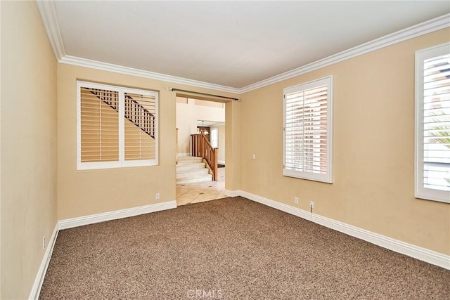 unfurnished room featuring light carpet, ornamental molding, stairway, and baseboards