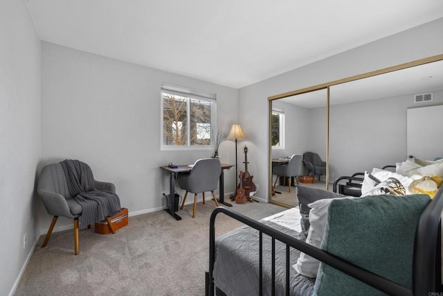 bedroom featuring light carpet, baseboards, visible vents, and a closet