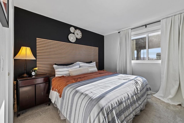 bedroom featuring light carpet