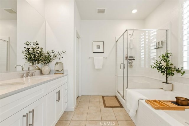 full bath featuring a garden tub, double vanity, visible vents, a stall shower, and tile patterned floors